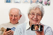 senior couple with smartphones