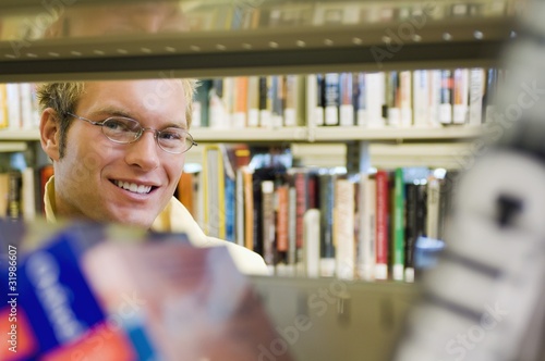Photo: Young Man In A Library Young Man In A Library