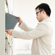 Handsome man, the selection of books in the library