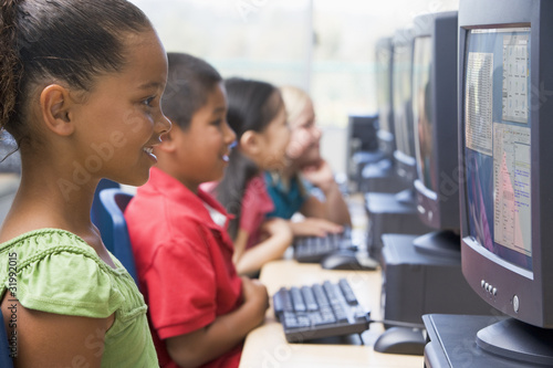 Photo: Kindergarten children learning how to use computers. Kindergarten children learning how to use computers.