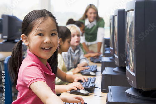 Photo: Kindergarten children learning how to use computers. Kindergarten children learning how to use computers.