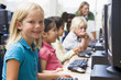 Kindergarten children learning how to use computers.
