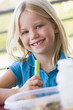 Girl eating lunch at kindergarten
