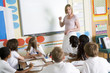 Foto: A teacher teaching a junior school class A teacher teaching a junior school class