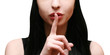 secret. beautiful girl with his finger near the lips secret. beautiful girl with his finger near the lips