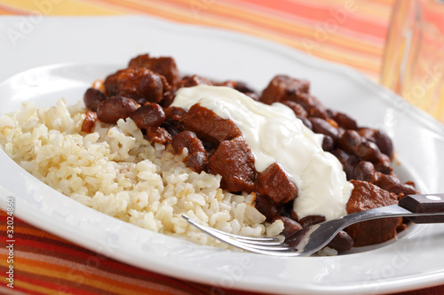 Photo: Chili con carne with rice and sour cream Chili con carne with rice and sour cream