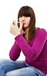 Teenage girl lighting cigarette isolated on white