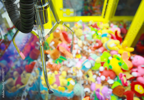 Photo: Capture device for soft toys on background of heap of toys Capture device for soft toys on background of heap of toys