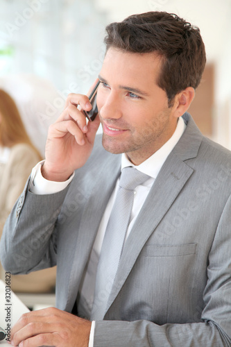 Photo: Businessman talking on the phone Businessman talking on the phone