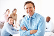 Mature business man smiling during meeting