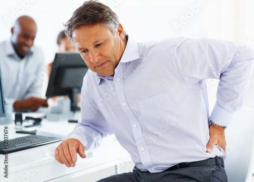 Photo: Mature business man stressed at work Mature business man stressed at work