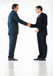 Full length of business colleagues shaking hands