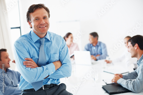 Foto: Mature team leader smiling Mature team leader smiling