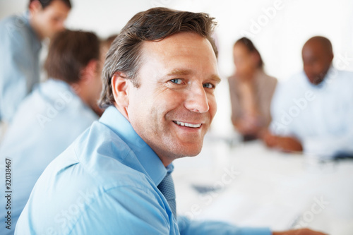 Photo: Mature business man smiling Mature business man smiling