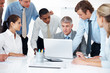 Business people planning work at meeting in office Business people planning work at meeting in office