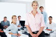 Photo: Successful business woman standing in office Successful business woman standing in office
