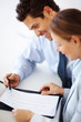 Young business partner dicussing business plan