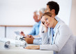 Young businesswoman bored in a meeting