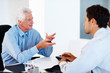 Financial planner discussing investment plans with a man
