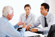 Agent advising to a young couple at office