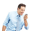 Angry young male executive yelling on his mobile phone