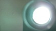 Front view of 8mm film projector lens in action