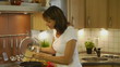 HD1080p25 Attractive woman cooking in the kitchen