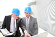Business partners working on industrial site