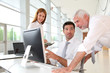 Photo: Office workers with manager in a meeting Office workers with manager in a meeting