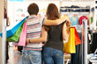 Photo: Backs of shoppers Backs of shoppers