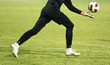 Soccer player running after the ball