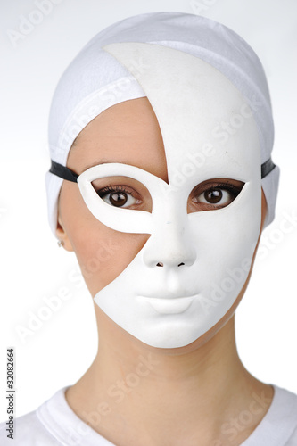 Photo: Portrait of a beautiful girl with white mask Portrait of a beautiful girl with white mask