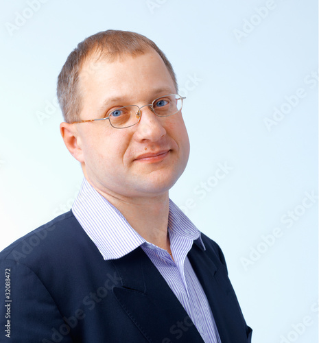 Photo: Man Looks at You Through Glasses. Man Looks at You Through Glasses.