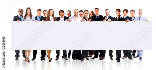 Photo: group of business people holding a banner ad group of business people holding a banner ad