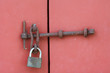 Red door with old iron lock Red door with old iron lock