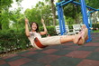 Carefree girl sitting on rope swings on the beach Carefree girl sitting on rope swings on the beach