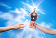 Foto: Hands of the person with a sports cup Hands of the person with a sports cup