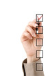 Hand with pen choosing one of three options