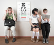 three person wearing spectacles in an office at the doctor