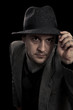 Gangster like man with hat and suit