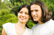 Happy smiling young couple on romantic date outdoors