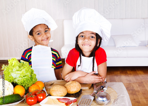Photo: Cute african american little cooks Cute african american little cooks