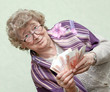 elderly happy woman with pack of money