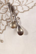 two retro coffee spoons tied on embroidered serviette two retro coffee spoons tied on embroidered serviette