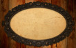 antique frame with blank paper on knotty wood wall