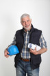 Construction site manager with security helmet Construction site manager with security helmet