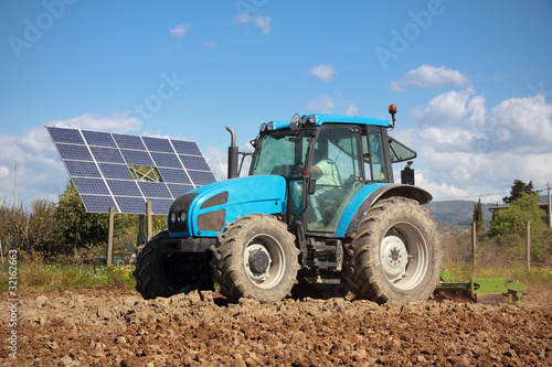Photo: tractor farming in field tractor farming in field