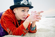 Young woman pointing fingers like using a gun,