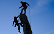 Team of climbers reaching the summit.