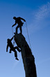 Team of climbers reaching the summit.